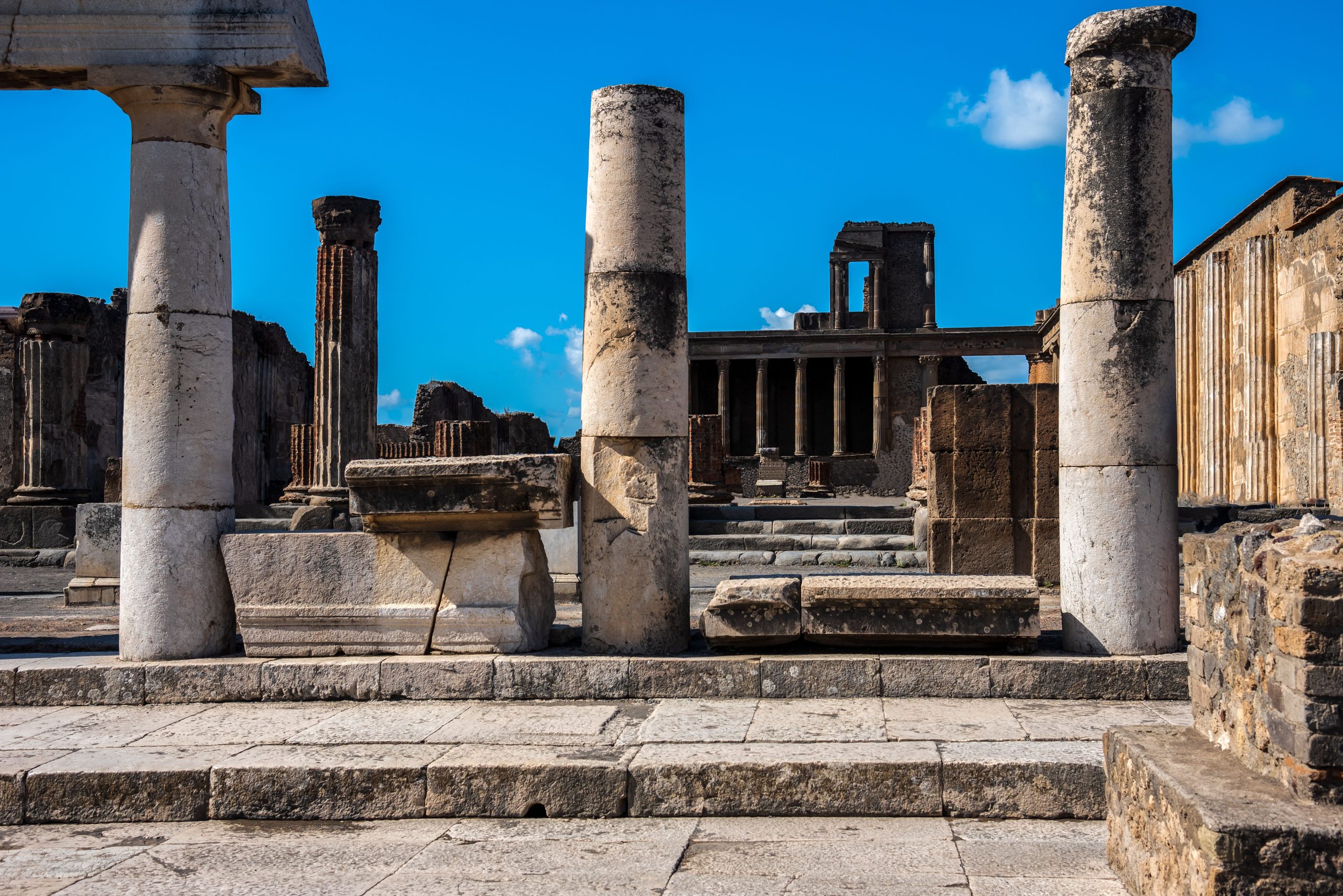 Well-preserved ruins of ancient Pompeii with classic stone columns, site of Rome's famous brothels