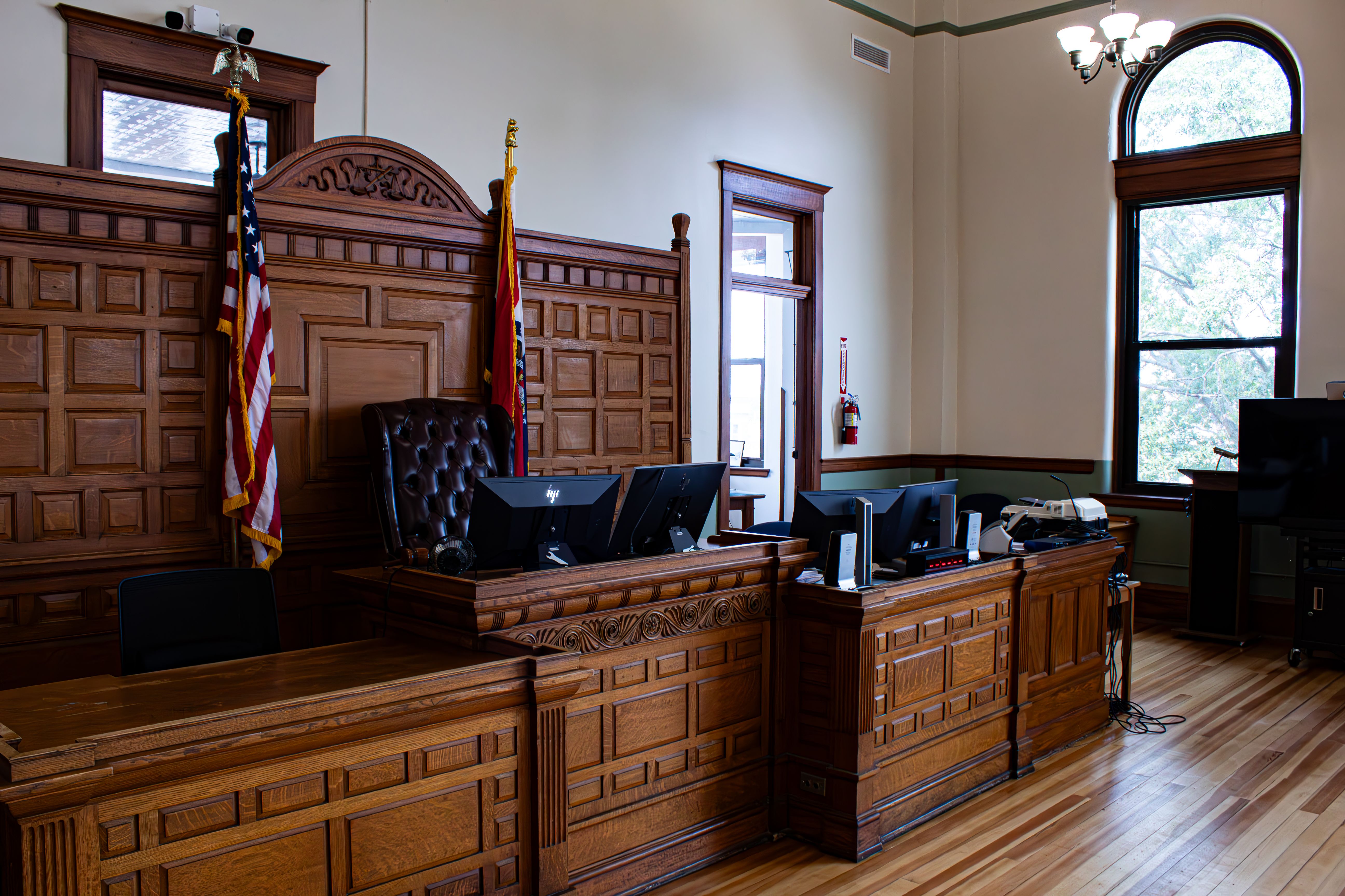 Interior of an American courthouse courtroom representing court hearings in a civil case.